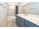 Bathroom featuring sleek vanity with quartz countertop and tiled shower with tub at 5414 Log Grove Ln, Orlando, FL 32829