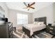 Comfortable bedroom features a queen-sized bed, soft lighting, and a calm, inviting atmosphere at 5414 Log Grove Ln, Orlando, FL 32829