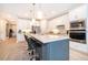 Gourmet kitchen with white cabinets, stainless appliances, and a center island with bar seating at 5414 Log Grove Ln, Orlando, FL 32829
