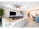 Open concept living space, flowing to the dining room, kitchen and stairs at 5414 Log Grove Ln, Orlando, FL 32829