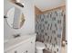 Bathroom featuring a vanity with sink and shower with patterned curtain at 5464 Windridge Ln, Orlando, FL 32810