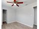 Bedroom showcasing light wood floors, neutral walls, and a closet at 5464 Windridge Ln, Orlando, FL 32810