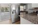 This home features stainless steel appliances and granite countertops in the kitchen at 5464 Windridge Ln, Orlando, FL 32810