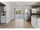 Bright kitchen with stainless steel appliances and sliding glass door to the screened porch at 5464 Windridge Ln, Orlando, FL 32810