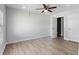 Spacious bedroom with ceiling fan and modern flooring at 5464 Windridge Ln, Orlando, FL 32810