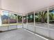 Screened in patio with views of the fenced in backyard at 5464 Windridge Ln, Orlando, FL 32810