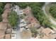 An aerial view of the townhouse complex with parking areas and green trees at 554 Northbridge Dr, Altamonte Springs, FL 32714