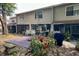 Townhome backyard featuring a wood deck, lush landscaping, and the building's exterior at 554 Northbridge Dr, Altamonte Springs, FL 32714