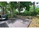 Backyard deck area with lush greenery and seating at 554 Northbridge Dr, Altamonte Springs, FL 32714