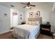 Bright bedroom with an ensuite bath, ceiling fan, and framed decor at 554 Northbridge Dr, Altamonte Springs, FL 32714
