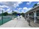 View of the clubhouse, tennis courts, and seating area at 554 Northbridge Dr, Altamonte Springs, FL 32714