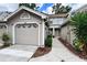 Charming townhome exterior with neutral siding, attached garage, and well-maintained landscaping at 554 Northbridge Dr, Altamonte Springs, FL 32714