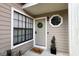 Close-up of front door with wreath, welcome mat, and exterior details at 554 Northbridge Dr, Altamonte Springs, FL 32714