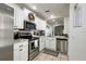 Bright kitchen boasts stainless steel appliances, granite countertops, and white cabinetry at 554 Northbridge Dr, Altamonte Springs, FL 32714