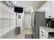 Kitchen features updated appliances, TV, and granite countertops at 554 Northbridge Dr, Altamonte Springs, FL 32714