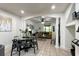 Open living and dining area with tile flooring, decorative columns and a ceiling fan at 554 Northbridge Dr, Altamonte Springs, FL 32714