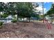 Community playground with picnic tables, surrounded by lush trees at 554 Northbridge Dr, Altamonte Springs, FL 32714