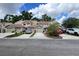 Street view showcasing townhomes with driveways and landscaped front yards at 554 Northbridge Dr, Altamonte Springs, FL 32714