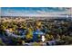 An aerial view shows the condo community with mature trees, community pool, and proximity to Universal Studios at 6040 Peregrine Ave # A01, Orlando, FL 32819