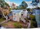 Aerial view of the home overlooking a lake and featuring a private stairwell at 6040 Peregrine Ave # A01, Orlando, FL 32819