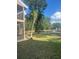 Scenic backyard view overlooking a pond with a fountain and bench seating at 6040 Peregrine Ave # A01, Orlando, FL 32819