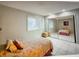 A bright bedroom with a mirrored closet maximizes space and enhances the room's appeal at 6040 Peregrine Ave # A01, Orlando, FL 32819