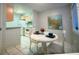 A cozy dining area that leads to an efficient kitchen space at 6040 Peregrine Ave # A01, Orlando, FL 32819