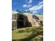 Exterior of home features a screened in porch on each floor, neutral siding at 6040 Peregrine Ave # A01, Orlando, FL 32819