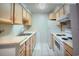 A bright kitchen featuring ample cabinets and essential appliances at 6040 Peregrine Ave # A01, Orlando, FL 32819