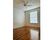 Bright bedroom features a ceiling fan, wood floors, and a window for natural light at 6141 Metrowest Blvd # 303, Orlando, FL 32835