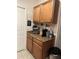 Coffee station featuring an espresso machine, standard coffee maker, and coffee decor at 6141 Metrowest Blvd # 303, Orlando, FL 32835