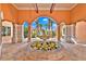 Lush courtyard fountain with colorful seasonal flowers adds beauty to the property at 6141 Metrowest Blvd # 303, Orlando, FL 32835