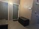 Apartment entryway featuring doors, an outdoor bench, and a unit number 303 sign at 6141 Metrowest Blvd # 303, Orlando, FL 32835
