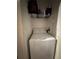 Laundry area featuring a new washing machine and storage shelving at 6141 Metrowest Blvd # 303, Orlando, FL 32835