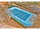 A community tennis court is surrounded by a tall fence and mature trees for a private, shaded feel at 6141 Metrowest Blvd # 303, Orlando, FL 32835