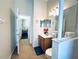 Bright bathroom with a single vanity, tile flooring, and a shower-tub combination at 618 N Hampton Dr, Davenport, FL 33897