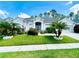 Charming single-story home with lush landscaping, manicured lawn, and inviting curb appeal at 618 N Hampton Dr, Davenport, FL 33897
