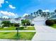 Charming single-story home with well-manicured landscaping, a two-car garage, and inviting curb appeal at 618 N Hampton Dr, Davenport, FL 33897