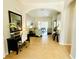 Bright foyer with tile flooring that leads to a view of the open-concept living area at 618 N Hampton Dr, Davenport, FL 33897