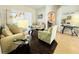 Cozy living room featuring stylish furniture, abundant natural light, and an open floor plan at 618 N Hampton Dr, Davenport, FL 33897