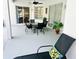 Outdoor patio with dining table, chairs, and a lounge chair perfect for entertaining at 618 N Hampton Dr, Davenport, FL 33897