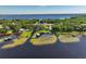 Aerial view of a lakefront community with private docks and boat lifts along the waterway at 6200 Alligator Lake E Shr, St Cloud, FL 34771