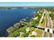 Captivating aerial shot of waterfront homes with private docks dotting a picturesque lake, conveniently located near a highway at 6200 Alligator Lake E Shr, St Cloud, FL 34771