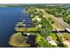 Aerial shot of waterfront homes with private docks on the waterway, complemented by lush greenery at 6200 Alligator Lake E Shr, St Cloud, FL 34771