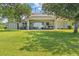 Wide backyard features a covered patio with outdoor seating and hot tub, perfect for relaxing outdoors at 6200 Alligator Lake E Shr, St Cloud, FL 34771