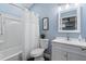 Clean and modern bathroom with a shower-tub combo, white vanity, and soft blue accents, offering a relaxing space at 6200 Alligator Lake E Shr, St Cloud, FL 34771