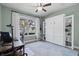 Versatile bedroom/office space with a Murphy bed, built-in shelving, and water view for maximum functionality at 6200 Alligator Lake E Shr, St Cloud, FL 34771