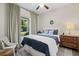 Bright bedroom with a large window, cozy bedding, and neutral décor, creating a serene and inviting atmosphere at 6200 Alligator Lake E Shr, St Cloud, FL 34771