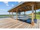 Covered boat lift with a motorboat inside, offering a convenient and protected way to store your boat on the water at 6200 Alligator Lake E Shr, St Cloud, FL 34771