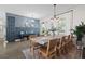 Elegant dining room featuring a long table with seating for eight and a decorative accent wall at 6200 Alligator Lake E Shr, St Cloud, FL 34771